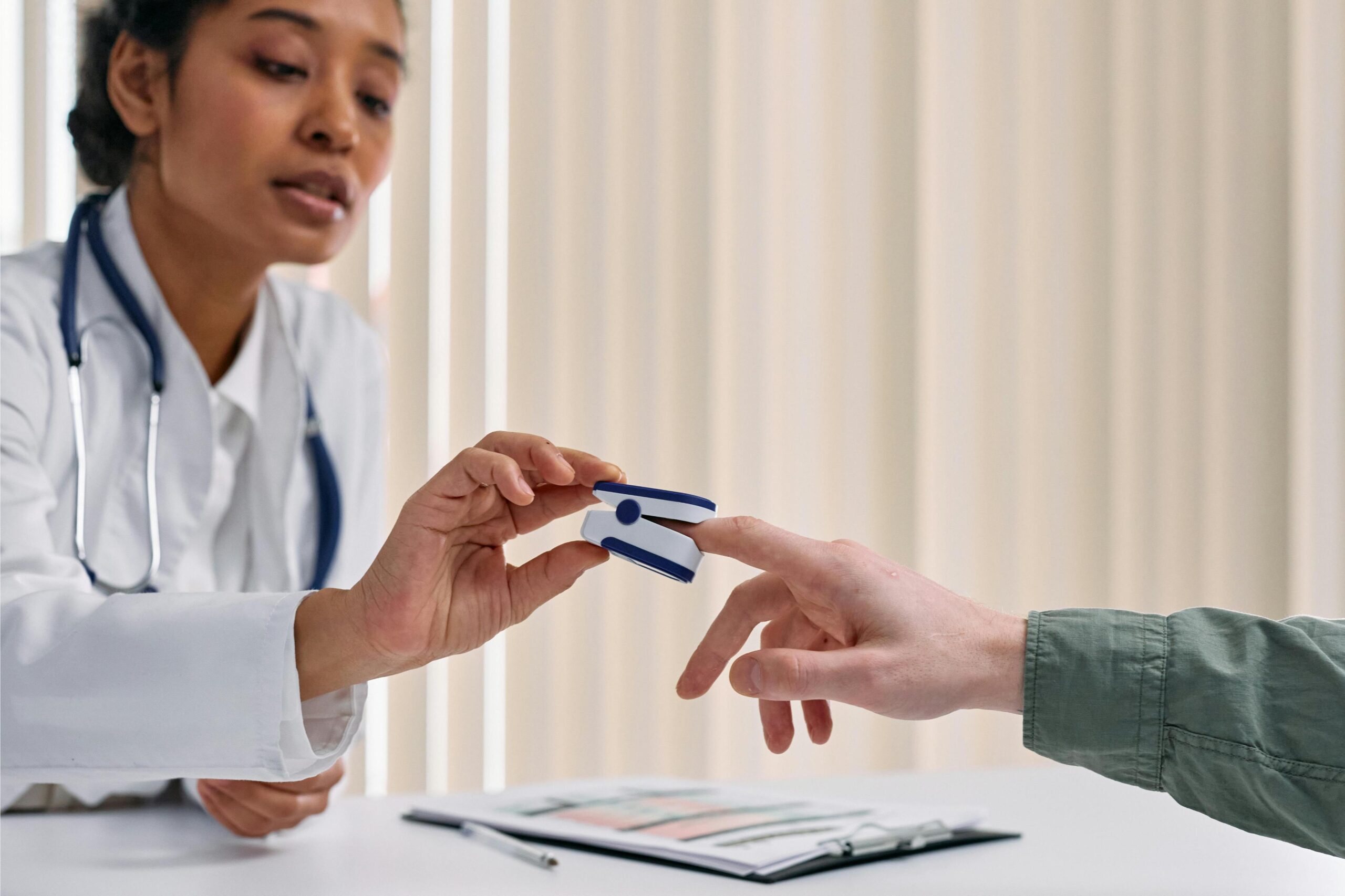 Doctor handing a patient a prescription or health card